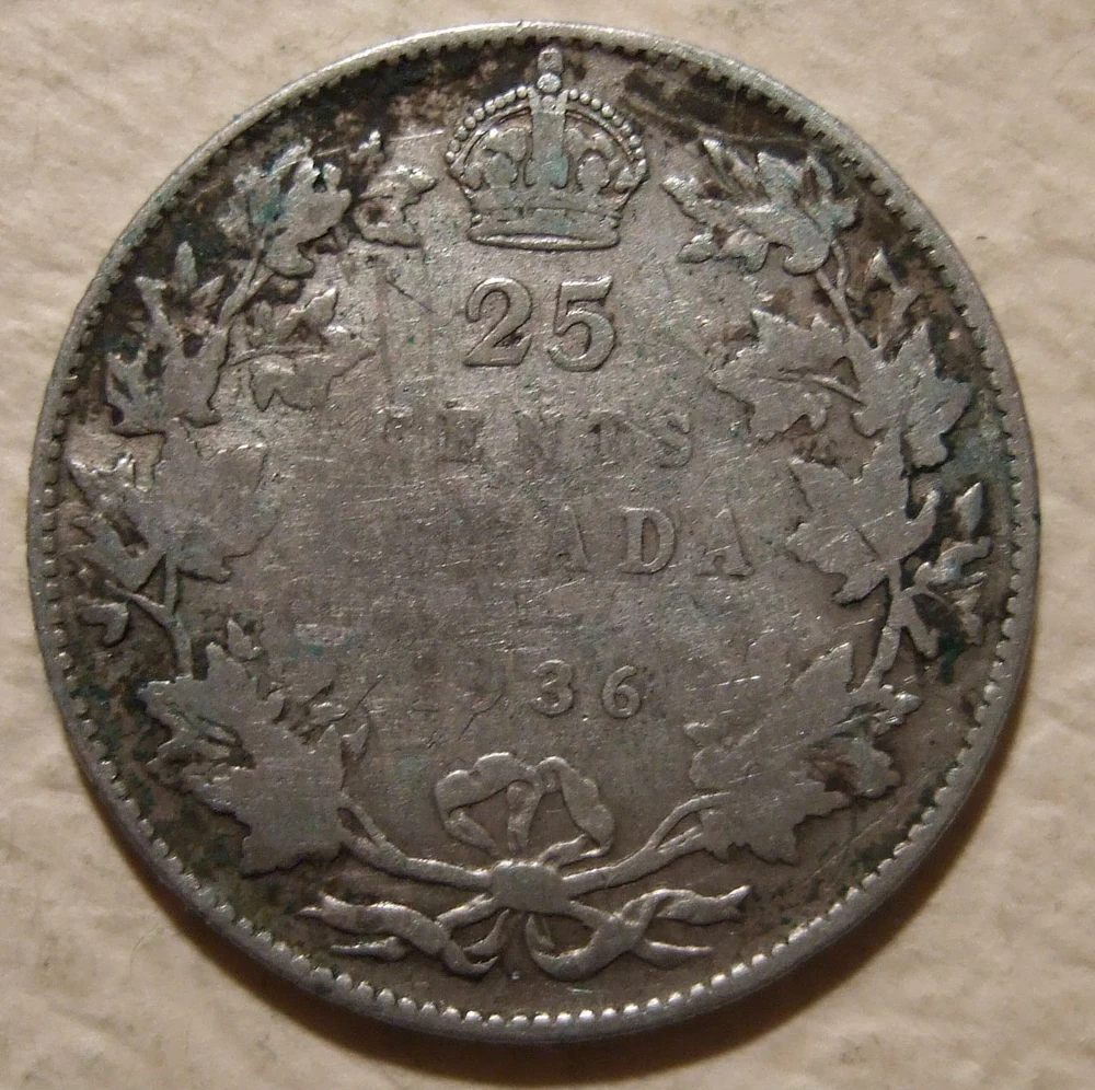 Canadian Quarter — 80% Silver reverse — 1936 Canadian twenty-five cents, George V portrait and denomination/maple wreath; Flickr license independently reviewed on Commons.