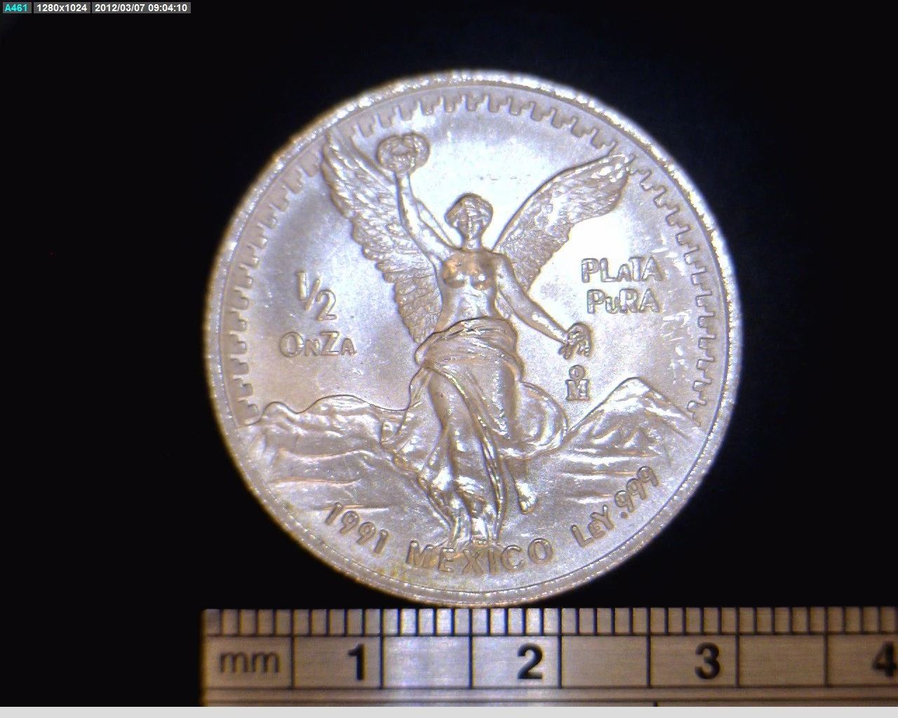 Reverse of a Mexican 1991 half-ounce silver Libertad showing Winged Victory, its fraction, date and .999 marking.