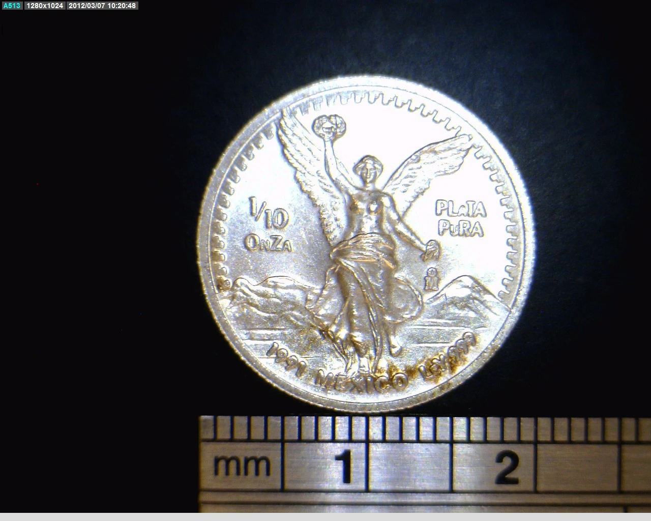 Reverse of a Mexican 1991 tenth-ounce silver Libertad showing Winged Victory, its fraction, date and .999 marking.