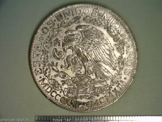 Obverse of the Mexican 1921 silver two pesos centennial coin showing the eagle and commemorative Roman-numeral dates.