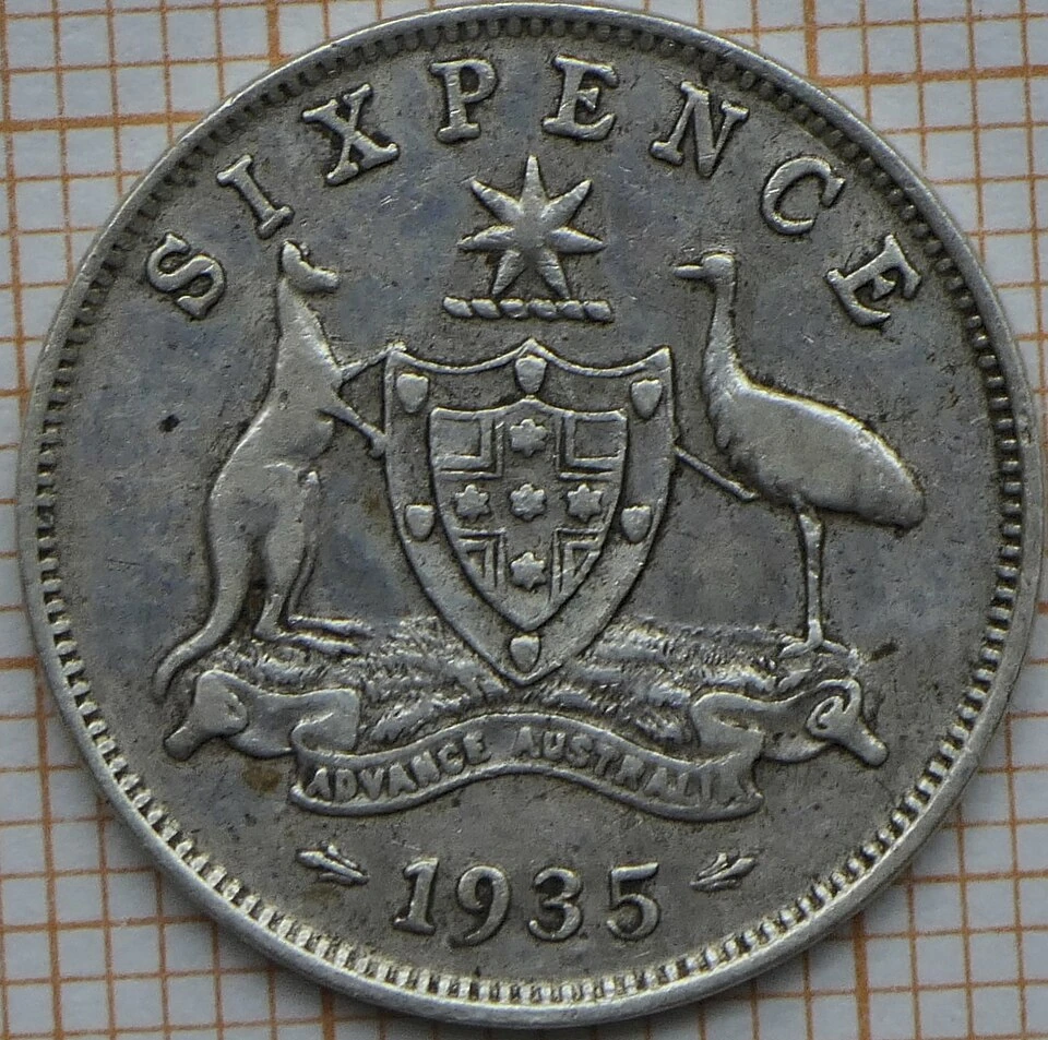 1935 Australian George V sterling sixpence reverse — SIXPENCE, star, arms, kangaroo and emu, with date 1935