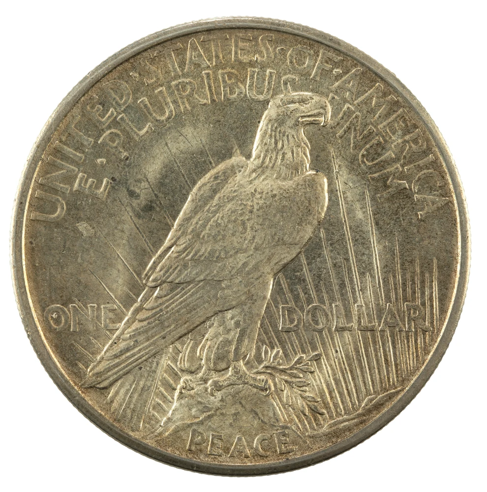 Original Peace Silver Dollar — 1921–1935 reverse — 1921 high-relief Peace dollar, representative original silver issue; later original issues have different relief