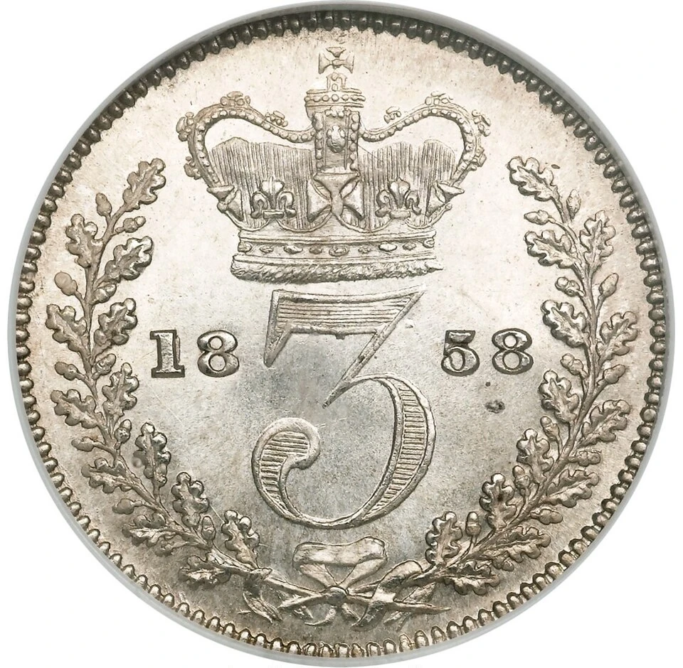 1858 British sterling threepence reverse — A crown stands above the numeral 3, flanked by the split date 18 and 58, inside a tied wreath.