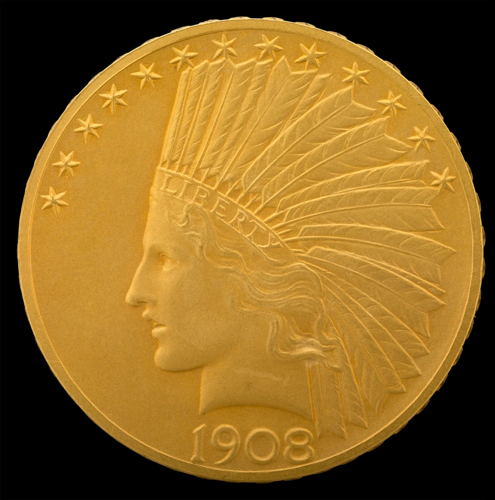Indian Head Eagle — Saint-Gaudens $10 obverse — 1908 Indian Head eagle with motto; initial 1907 issues lack this motto